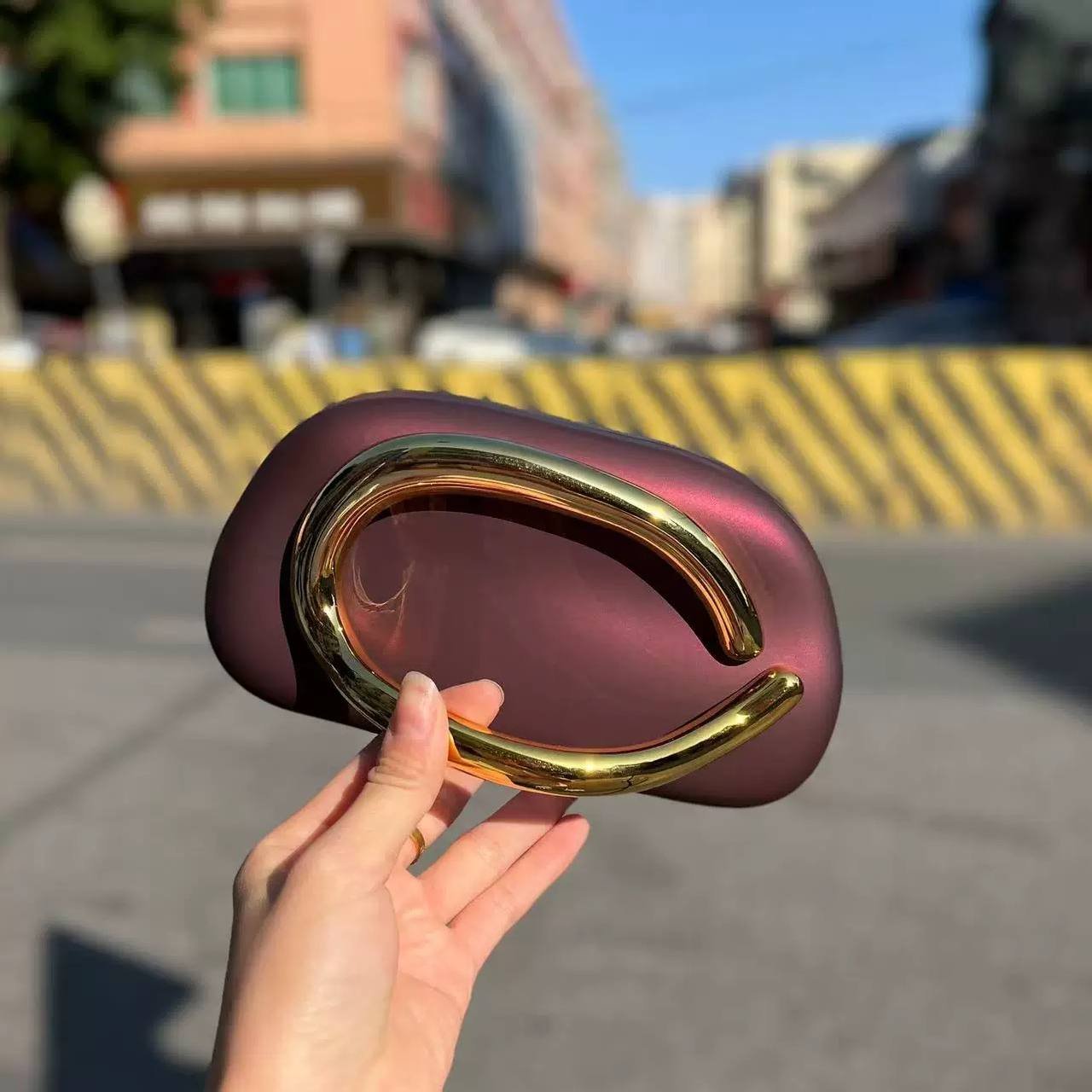 Burgundy clutch bag